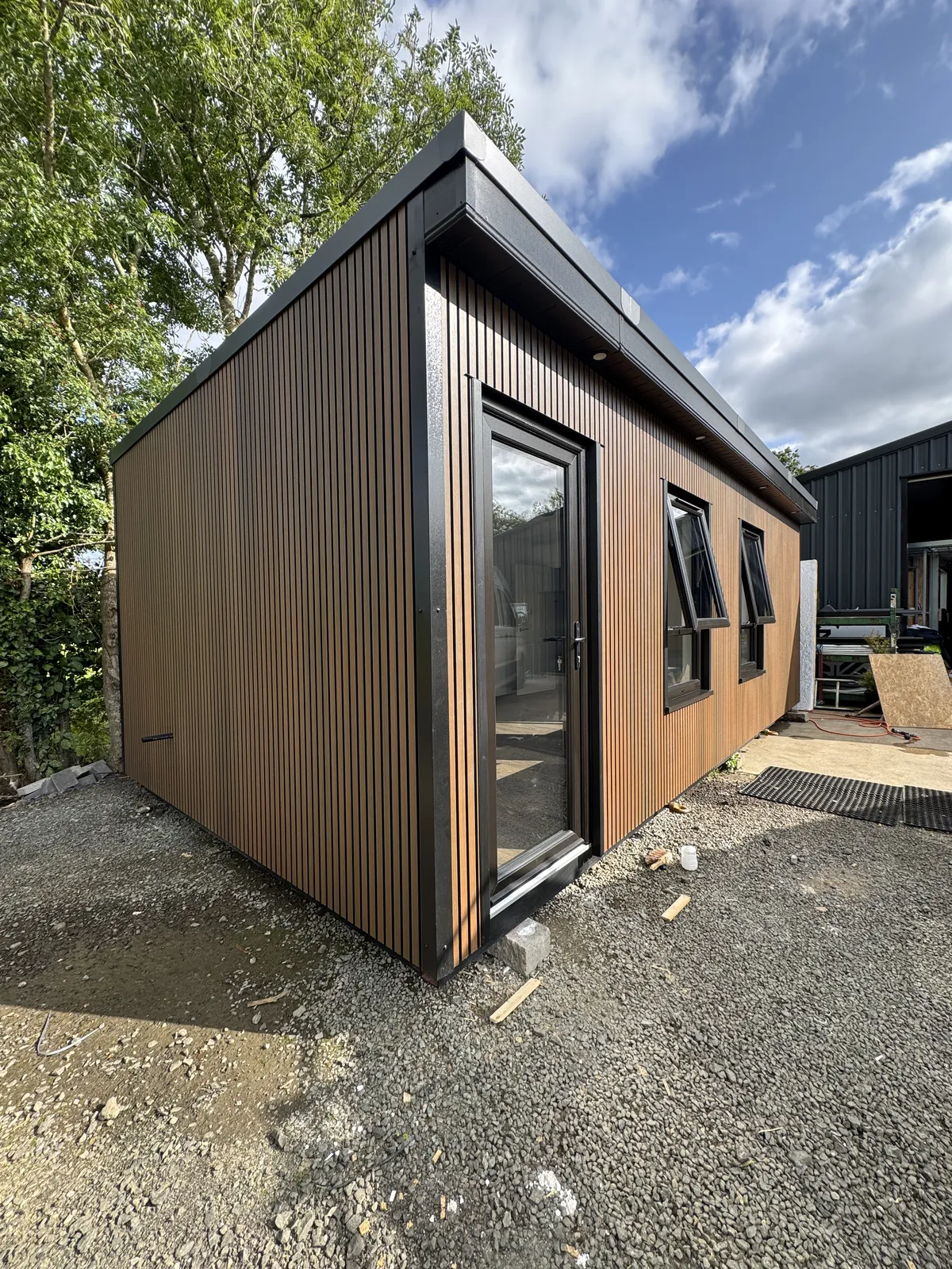 Large timber-clad garden room, side view